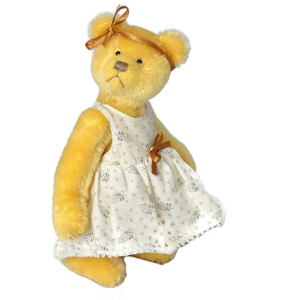 Miniature handmade teddy bear in yellow German mohair