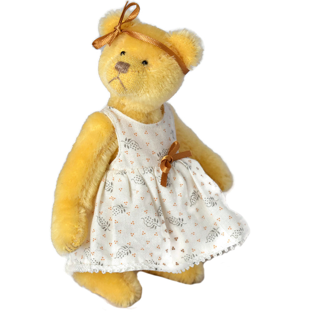 Miniature deddy bear in cotton dress