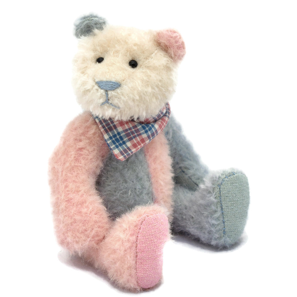 Blue and pink panda teddy bear sitting